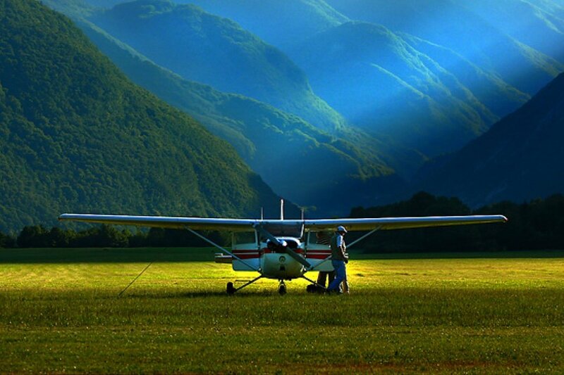 Small plane on a grassy field
