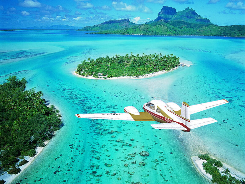 Small Plane over Tropical Island