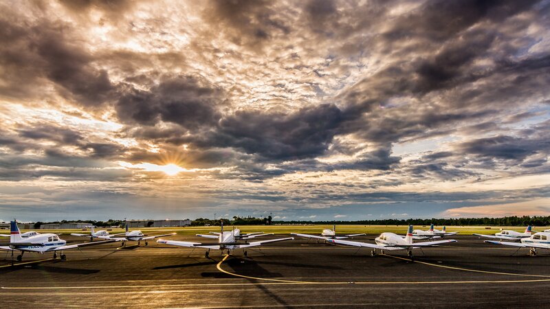 Small Planes on Tarmac — Gray, Dramatic, Sunset