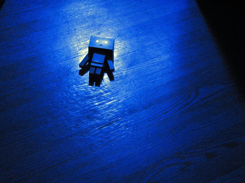 small robot on blue surface