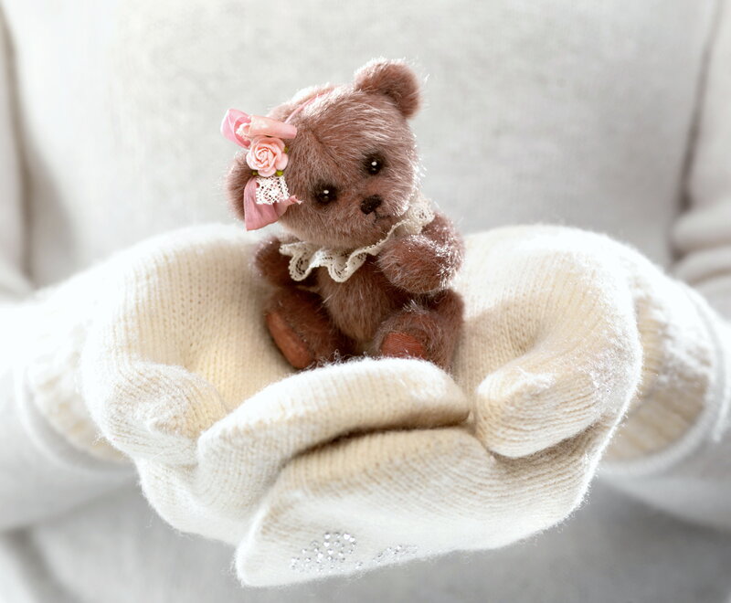 Small Teddy Bear in Hands