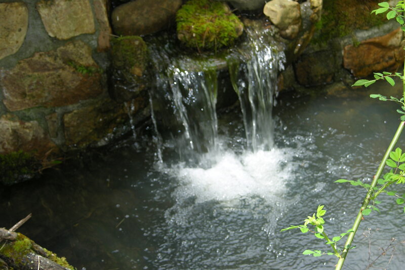 Small waterfall in a stone basin