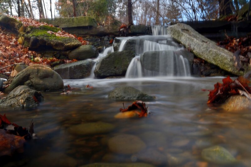 Small Waterfall in Forest — Brown, Serene, Autumn, Photograph, Fallen Leaves, Rocks