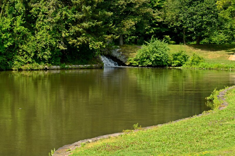 Small Waterfall in Pond — Green, Serene, Afternoon
