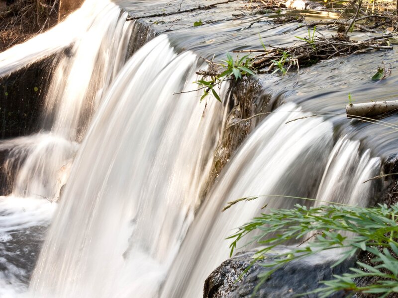Small Waterfall in Stream — White