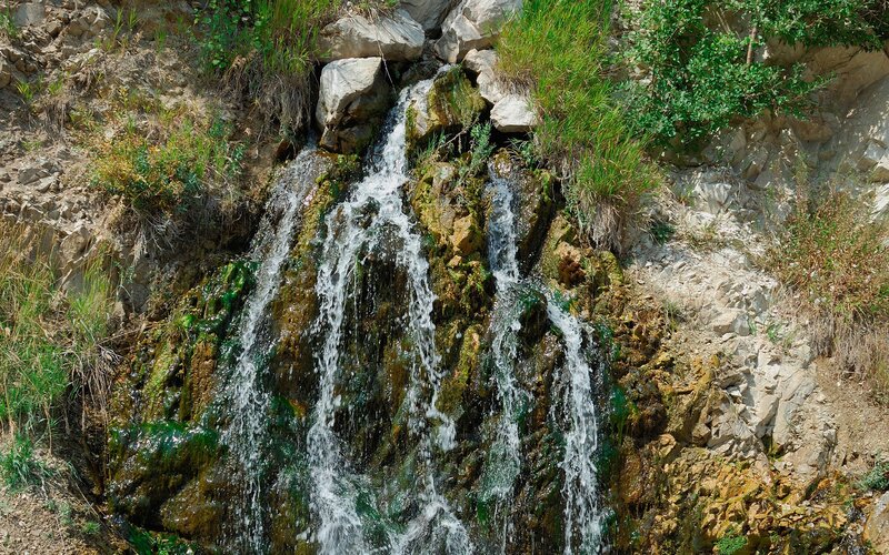 Small waterfall on rocky hillside