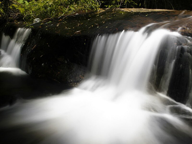 Small Waterfall over Rocks — White