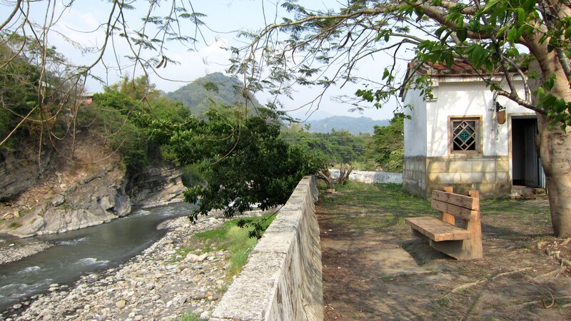 Small White Building by River
