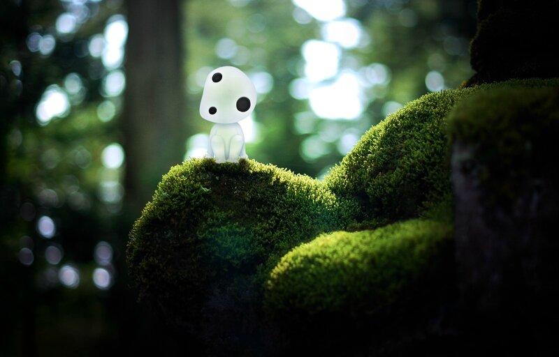 Small White Figure on Moss