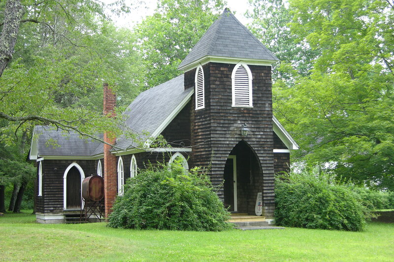 small wooden church in forest