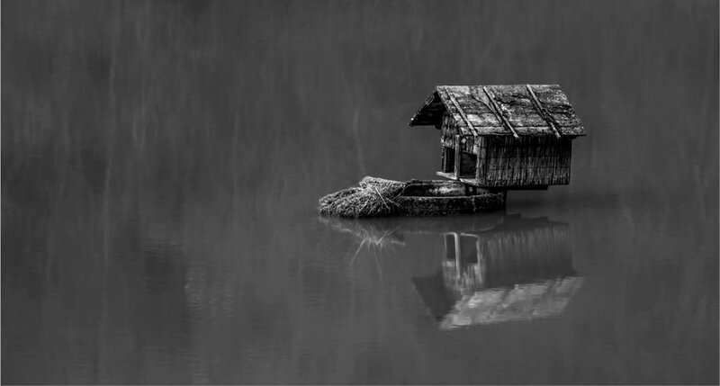 Small Wooden House on Water