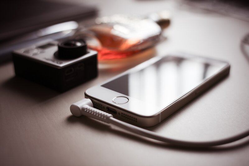 Smartphone charging on desk