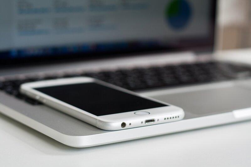 smartphone on laptop