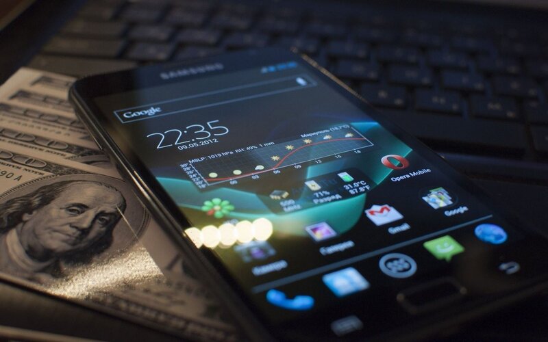 Smartphone on Money — Black, Dark, Night