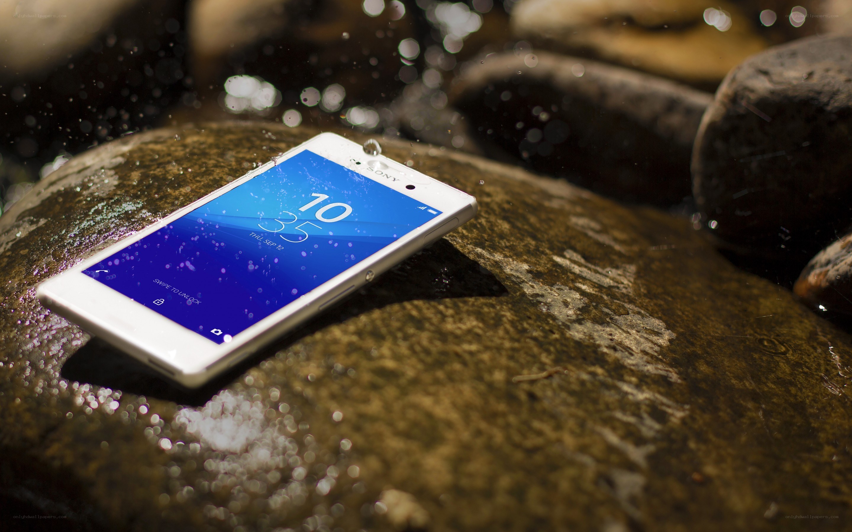 Smartphone on wet rock