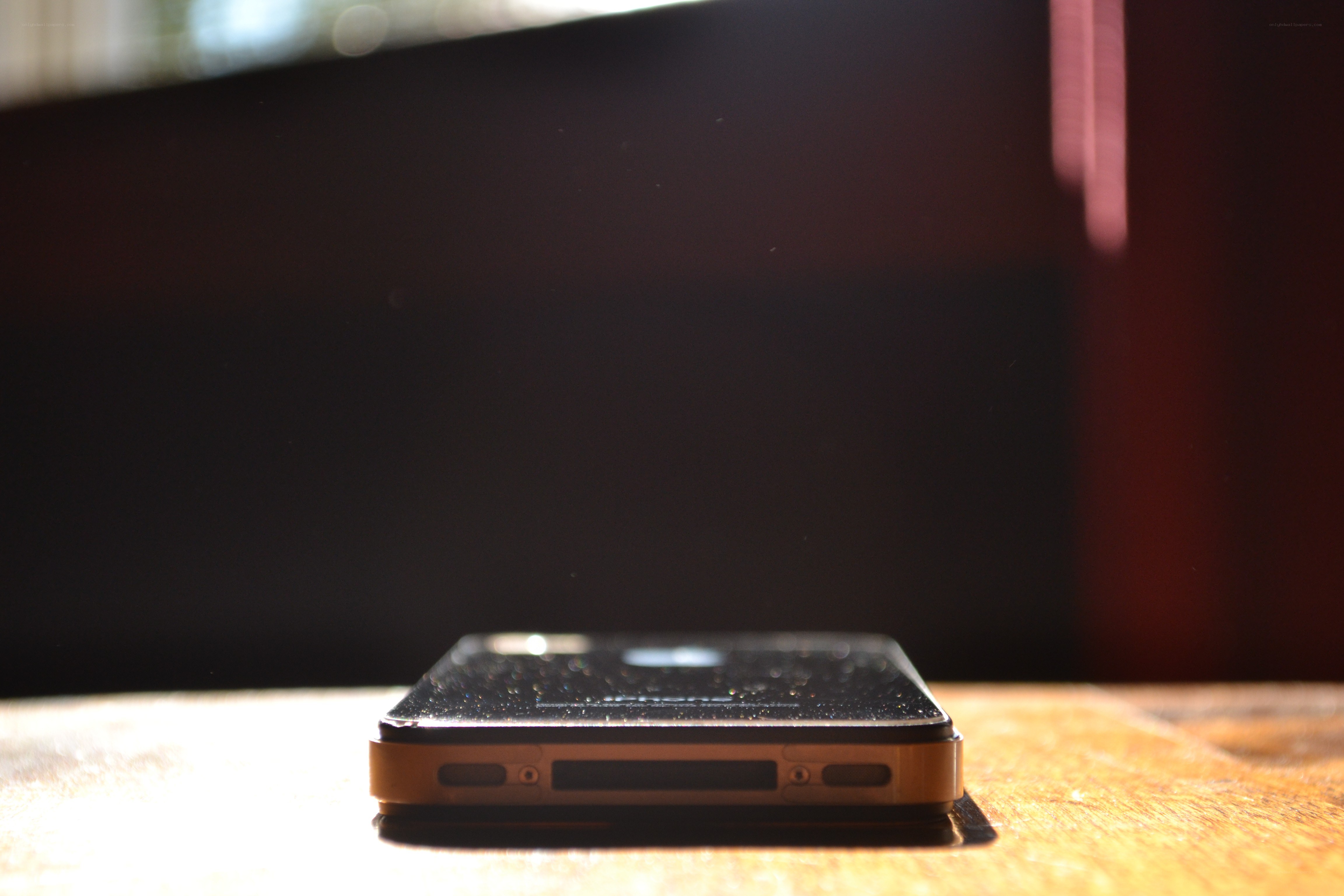smartphone on wooden surface