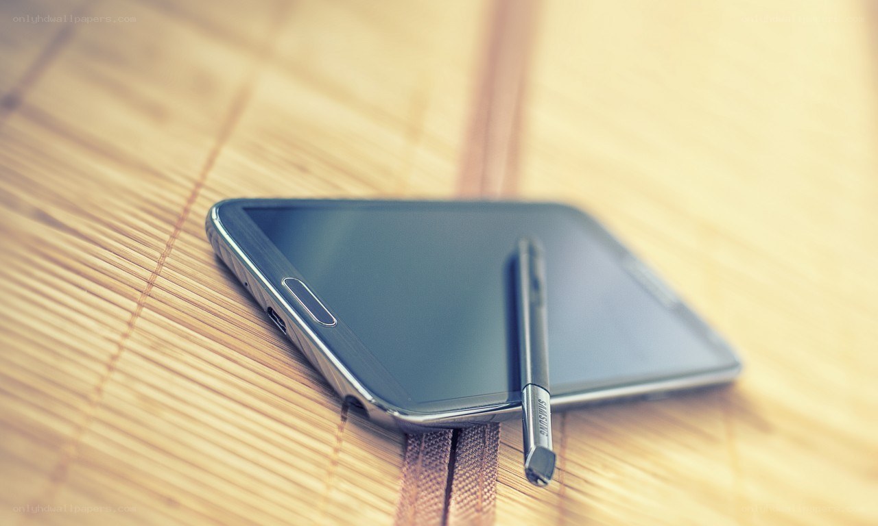 smartphone with stylus on bamboo