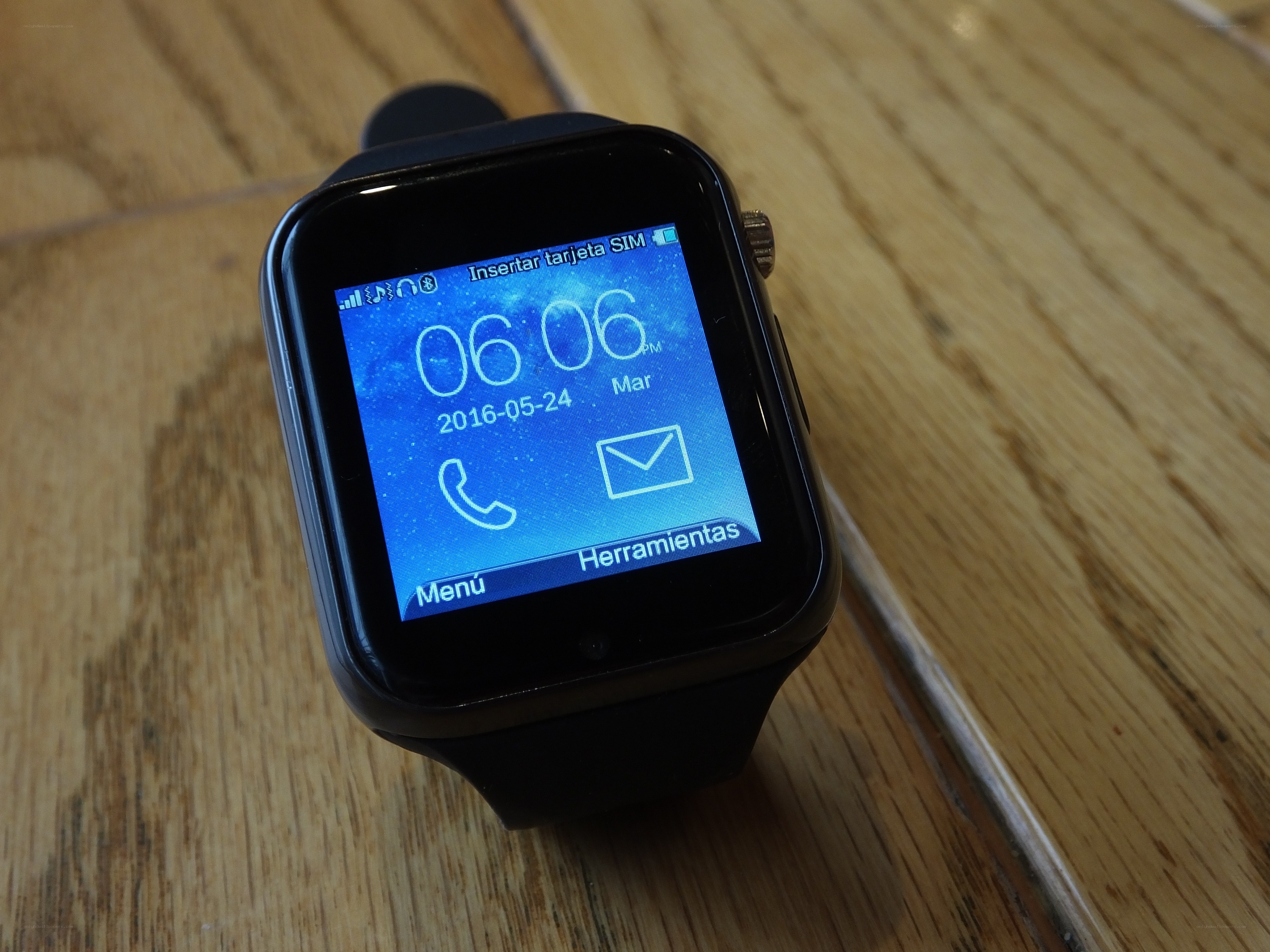smartwatch on wooden surface