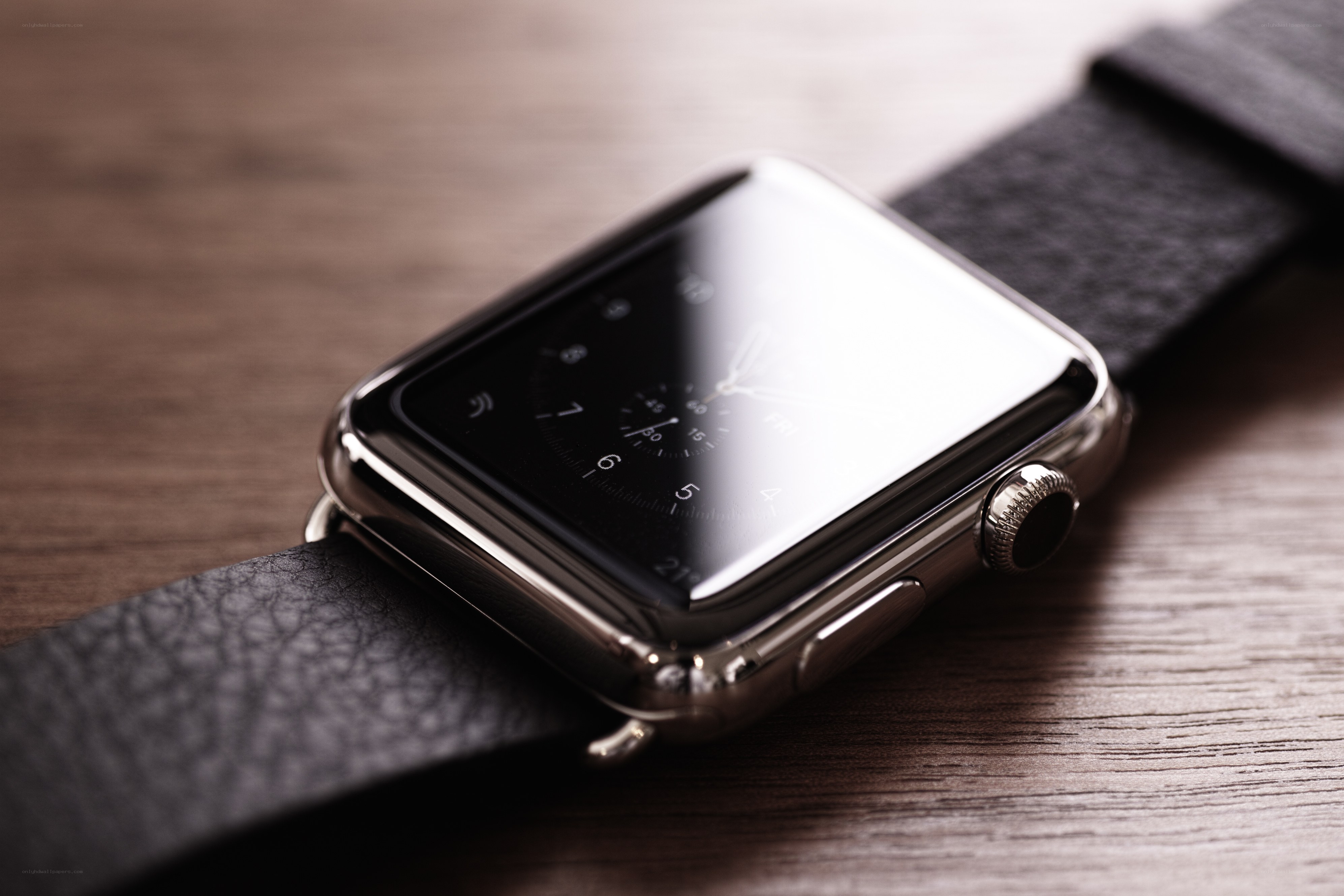 smartwatch on wooden surface