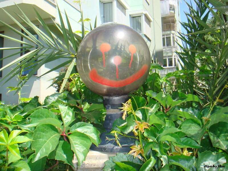 Smiley face balloon in garden