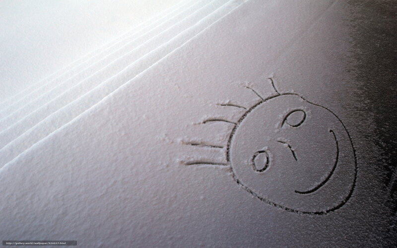 smiley face drawn in snow