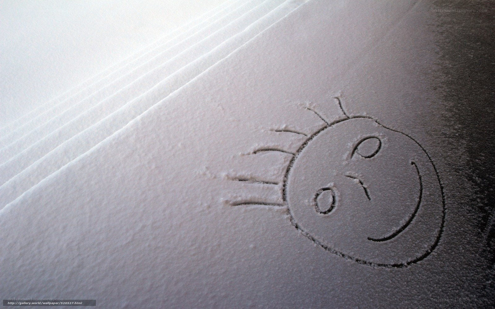 smiley face drawn in snow