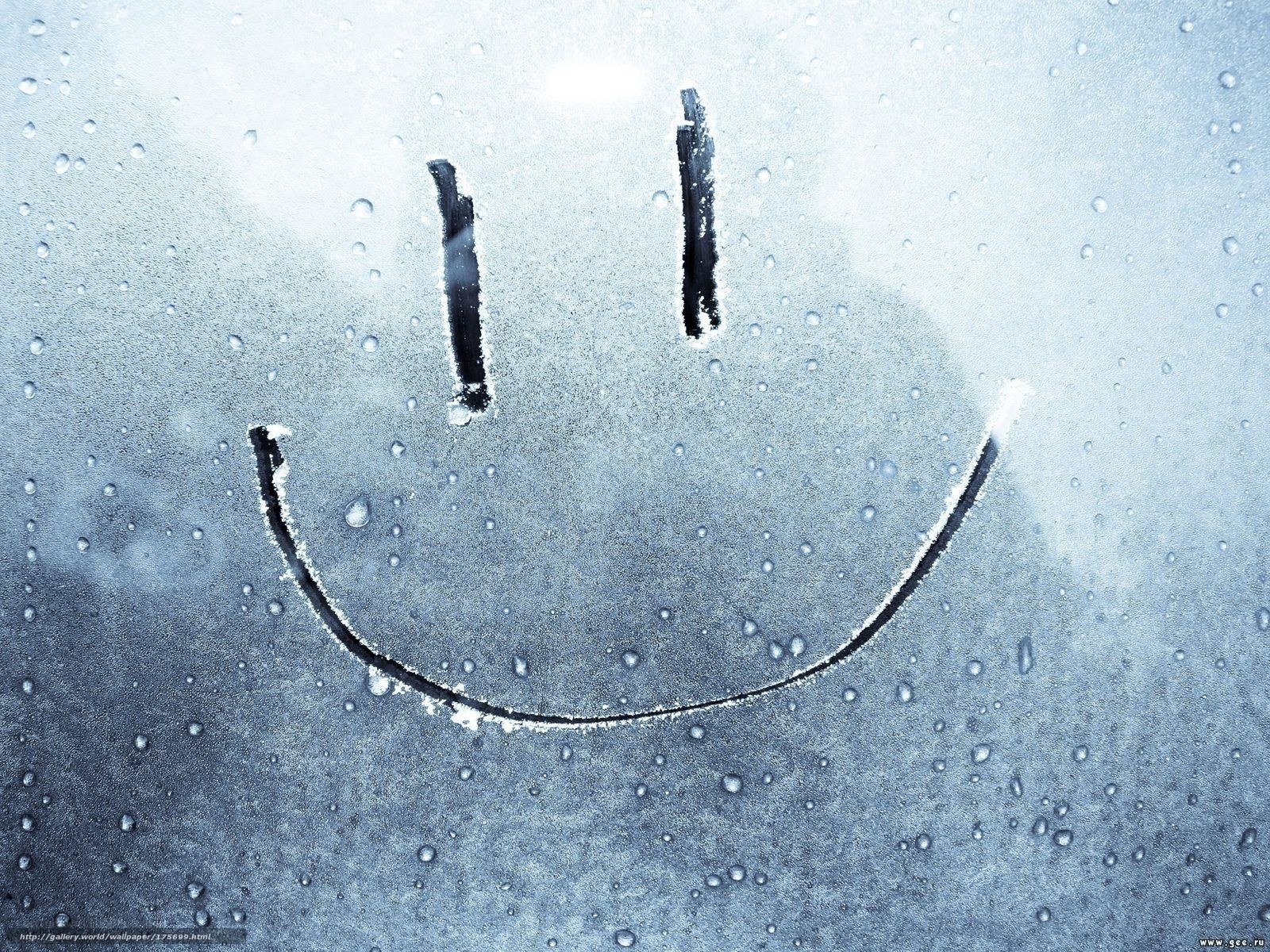 smiley face on fogged glass