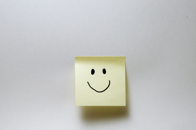 smiley face on sticky note