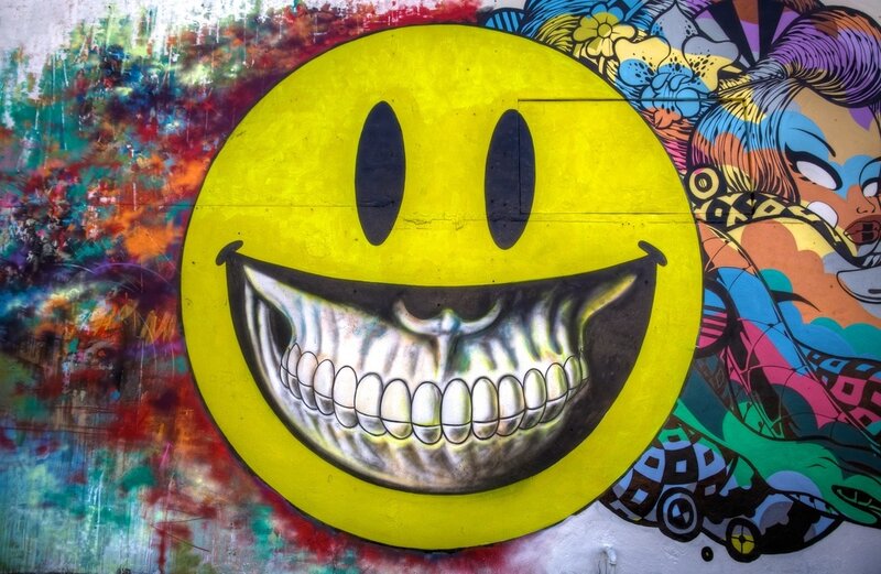 Smiley Face with Skull Teeth
