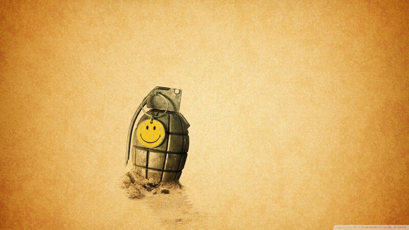 smiley grenade in sand