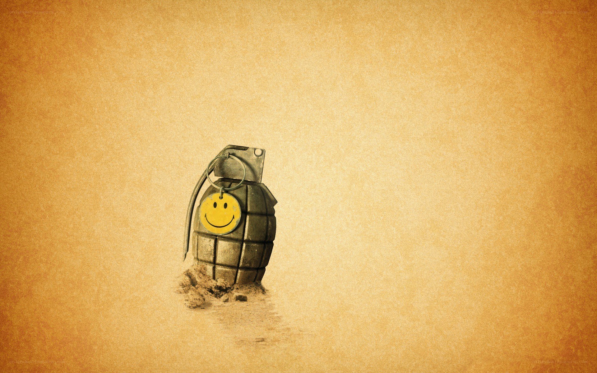 smiley grenade on sand