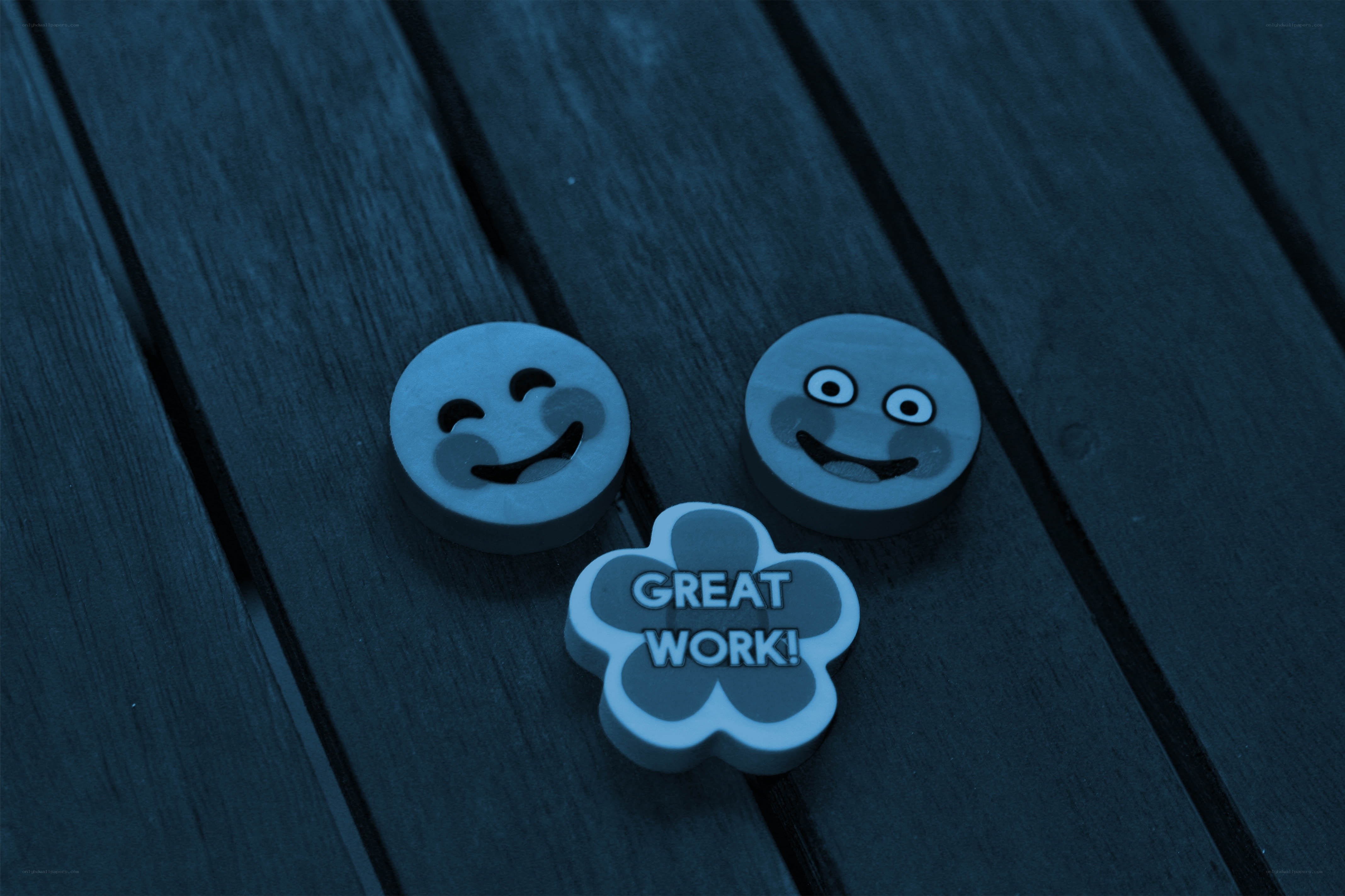 Smiley tokens on wood