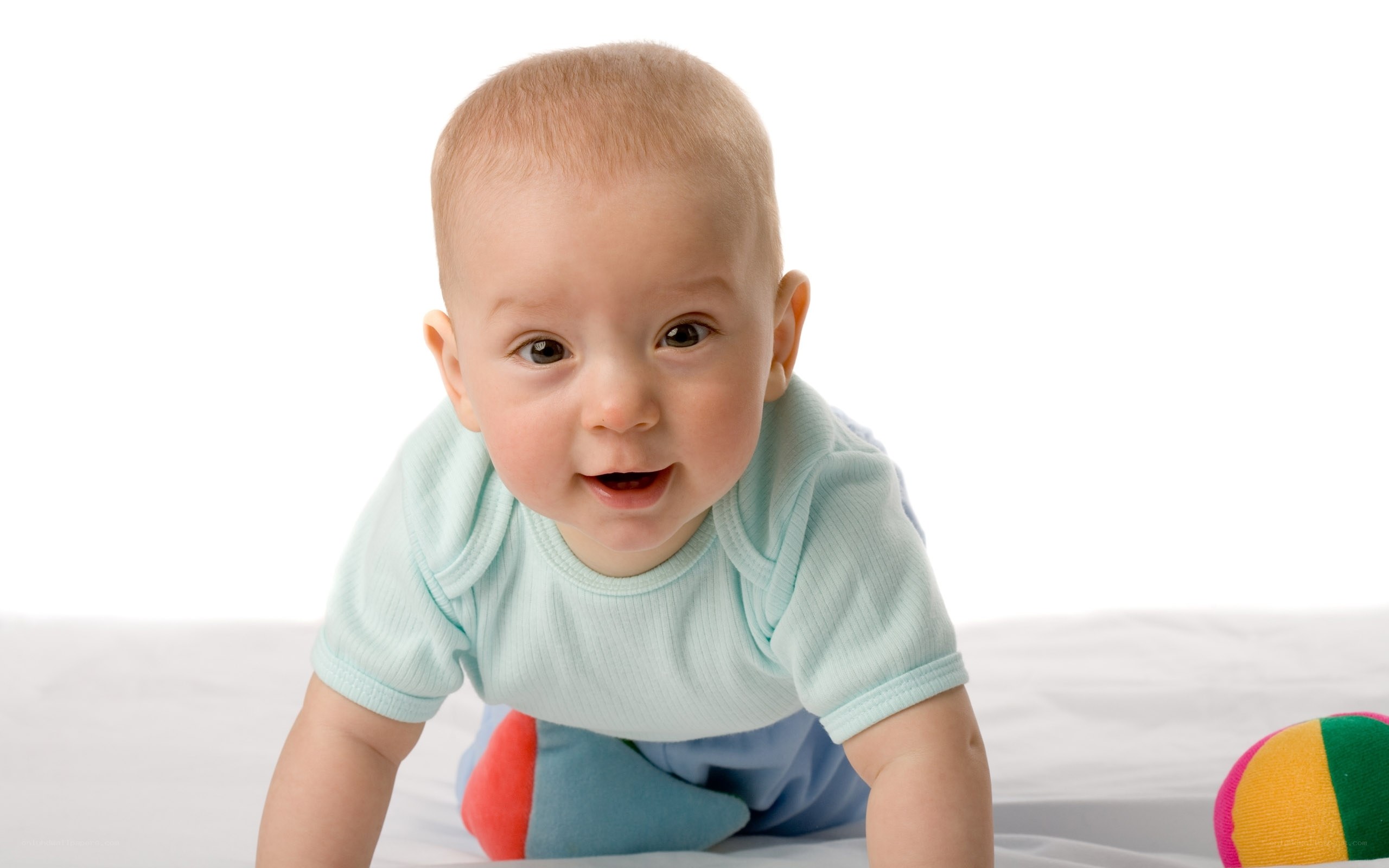 smiling baby crawling