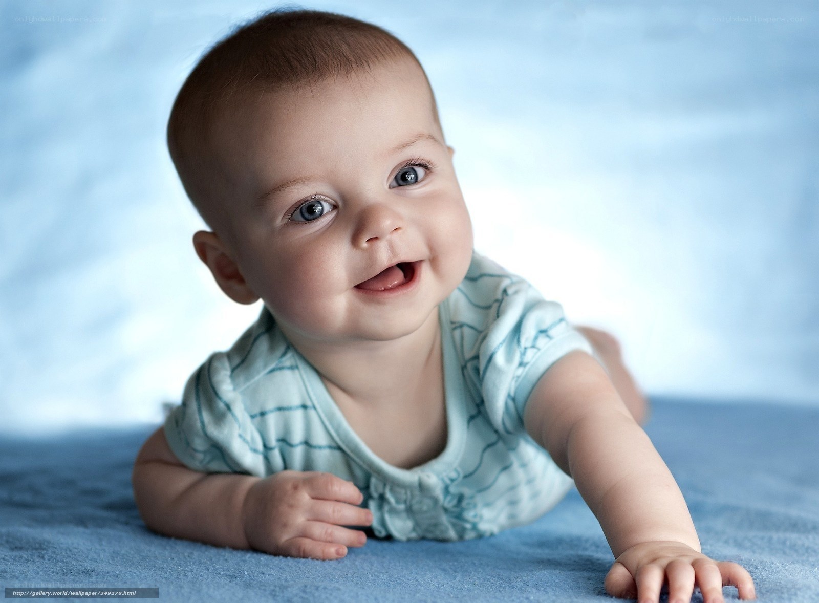 smiling baby crawling