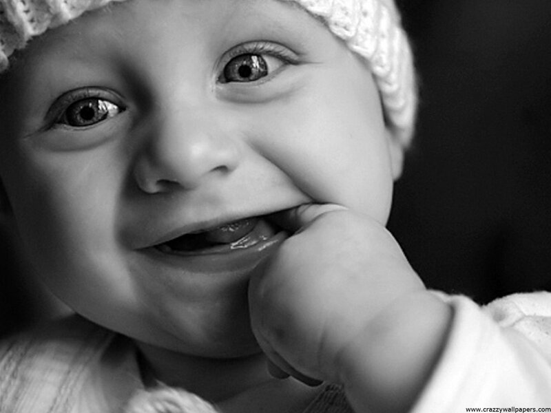 smiling baby in black and white
