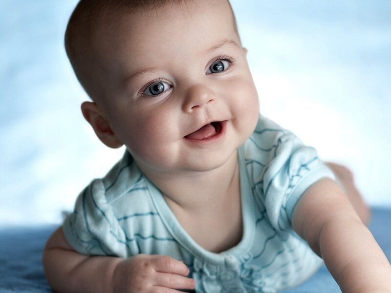 Smiling Baby in Blue Shirt