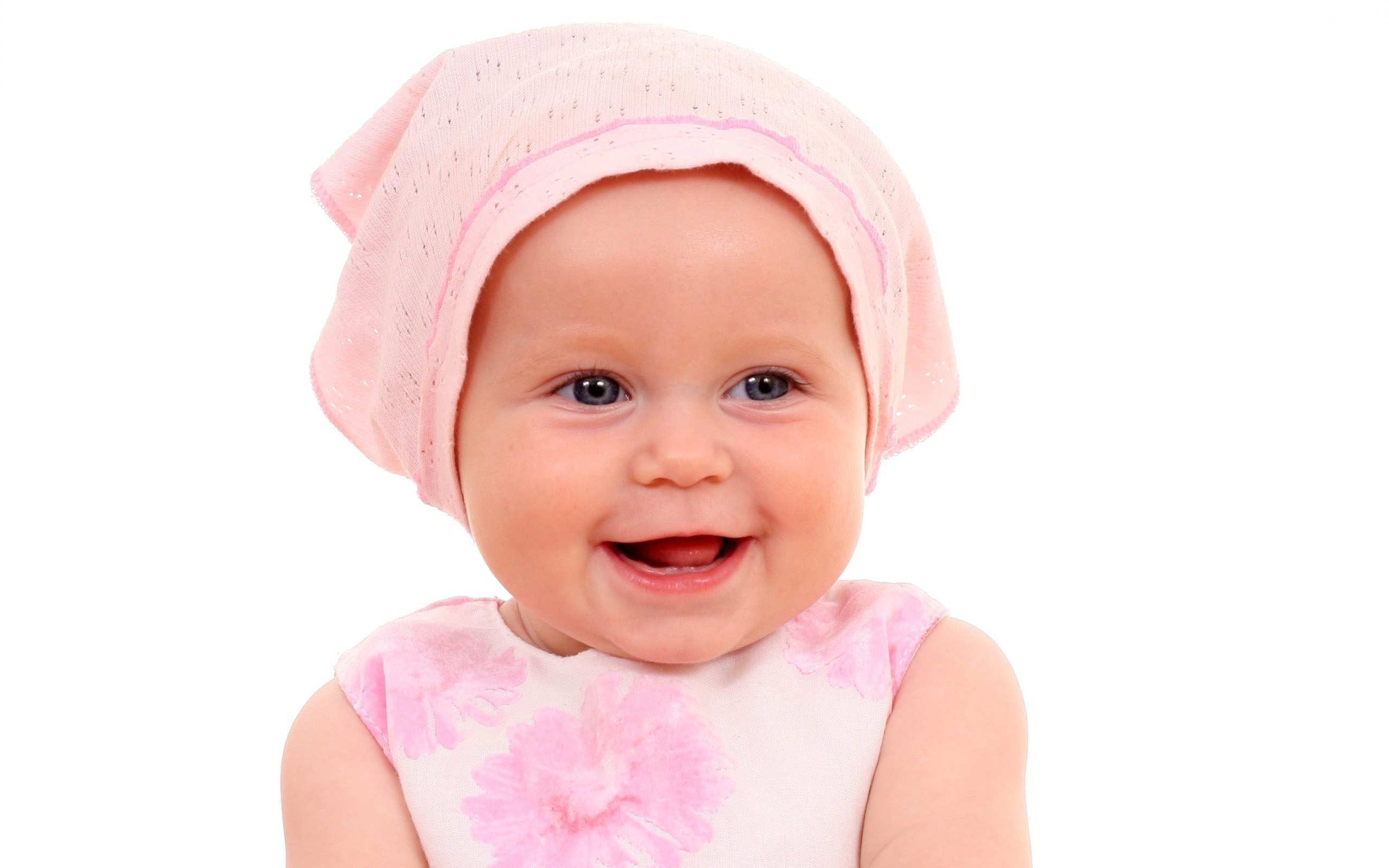 smiling baby in pink hat