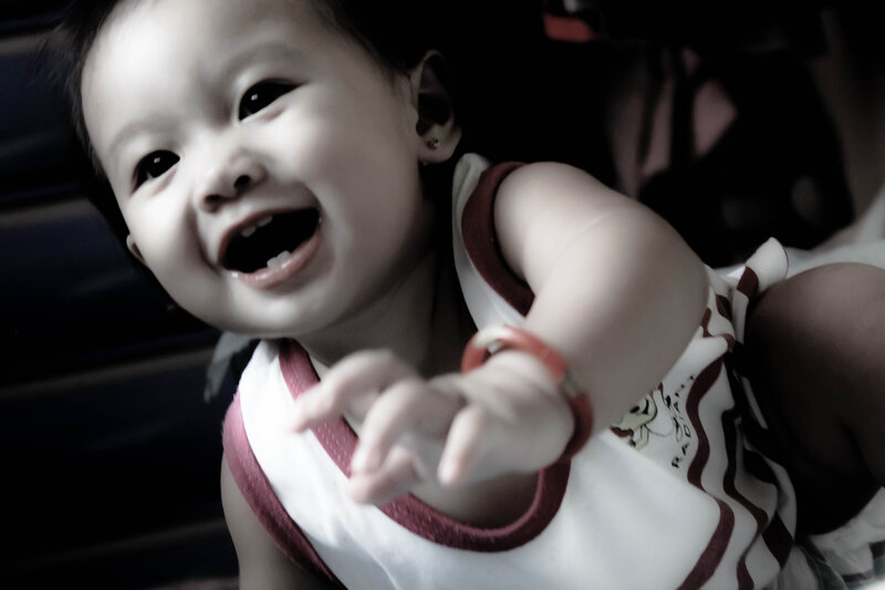 Smiling Baby in Striped Shirt — White