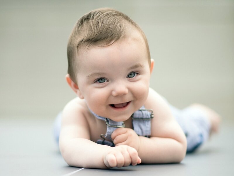 Smiling Baby Lying Down — Blue
