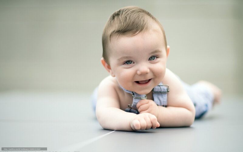 Smiling Baby Lying Down — Gray, Happy