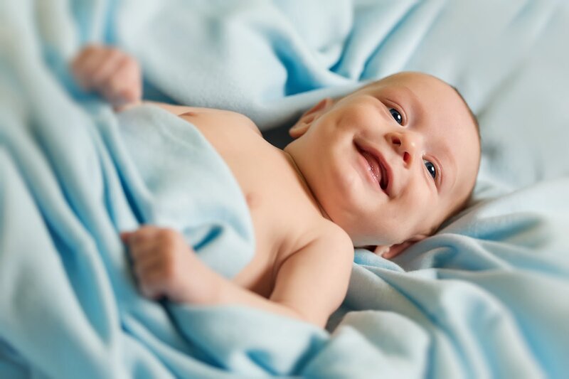 Smiling Baby on Blanket