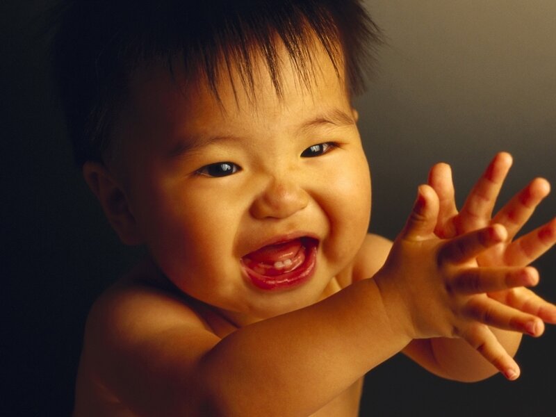 Smiling Baby Reaching Out