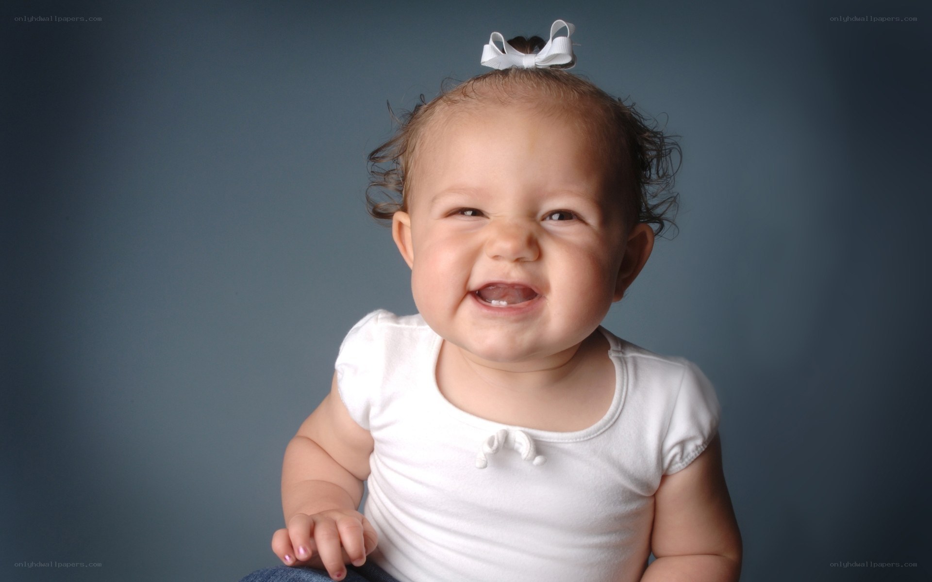smiling baby with bow
