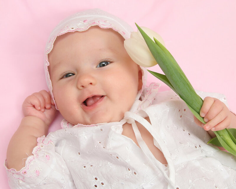 smiling baby with tulip