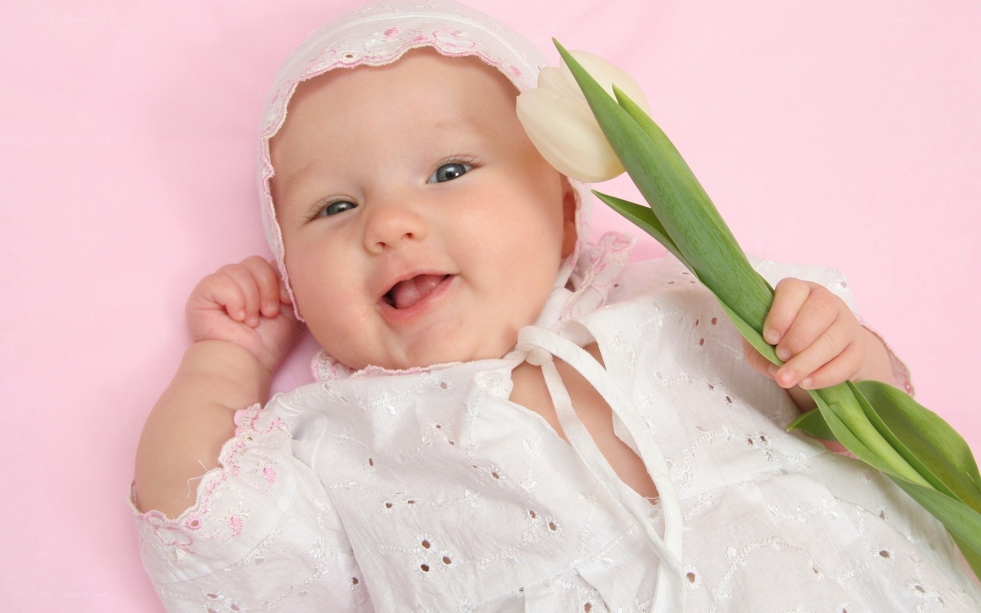 smiling baby with tulip