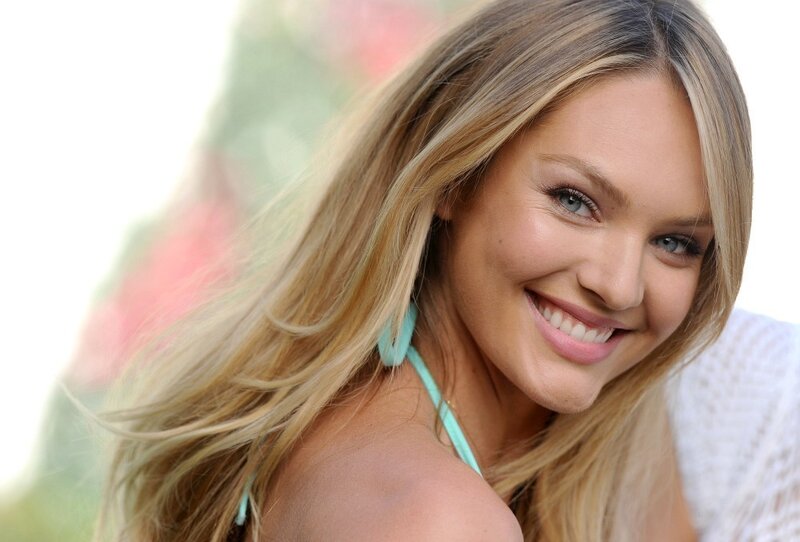 Smiling blonde woman in daylight