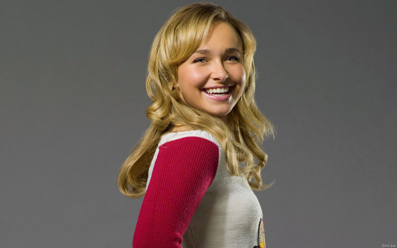 smiling blonde woman in sweater