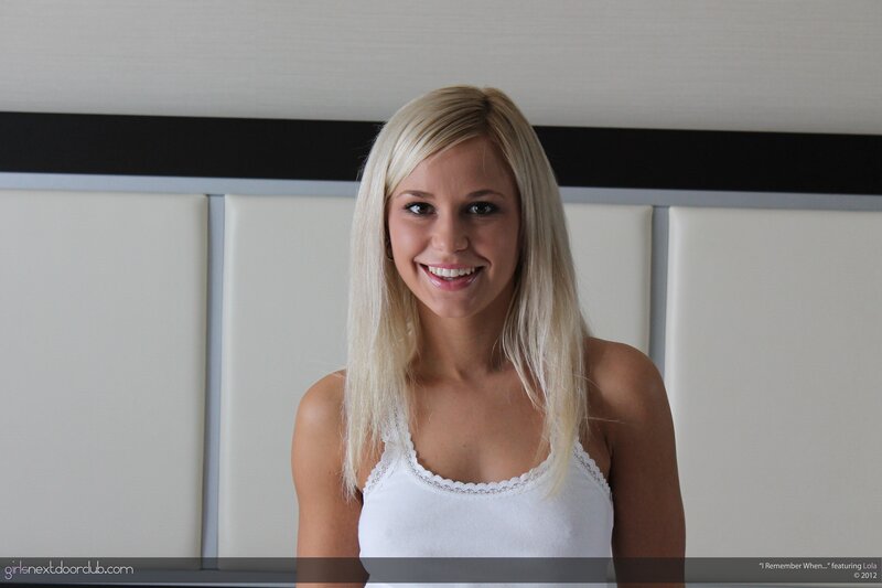 Smiling blonde woman in white top