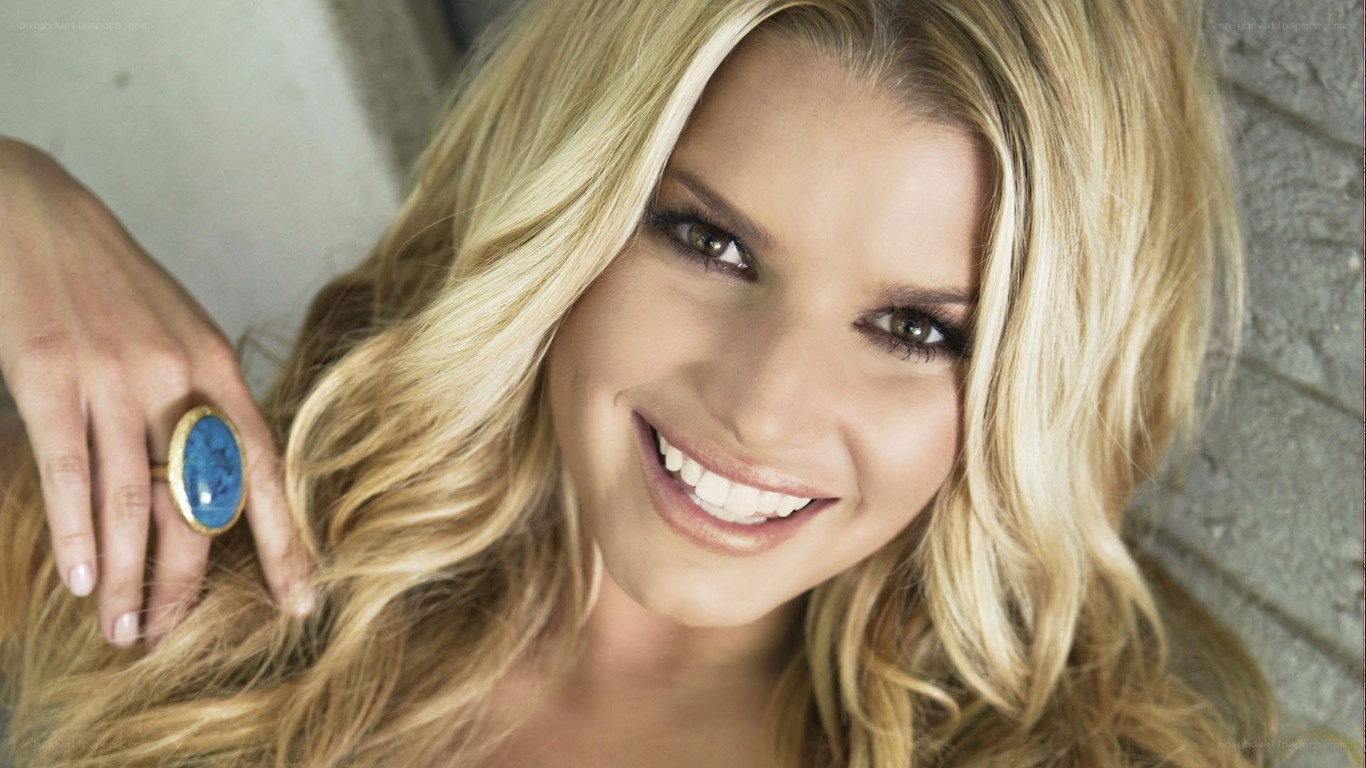 smiling blonde woman with ring