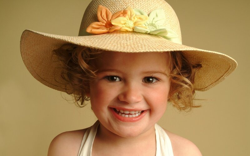Smiling child in straw hat